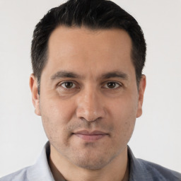 Neutral white adult male with short  black hair and brown eyes
