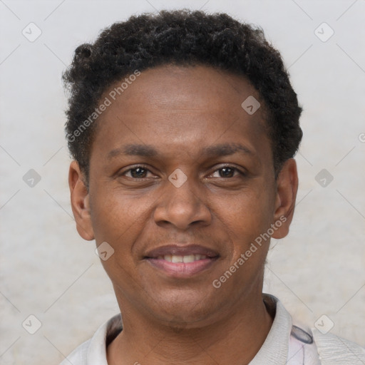 Joyful black young-adult male with short  brown hair and brown eyes