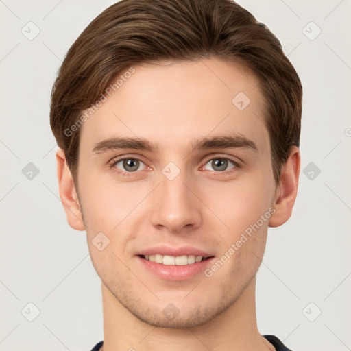 Joyful white young-adult male with short  brown hair and grey eyes