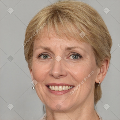 Joyful white adult female with medium  brown hair and grey eyes