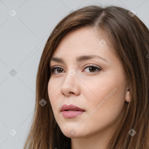 Neutral white young-adult female with long  brown hair and brown eyes