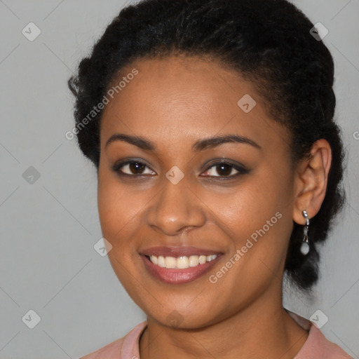 Joyful black young-adult female with long  brown hair and brown eyes