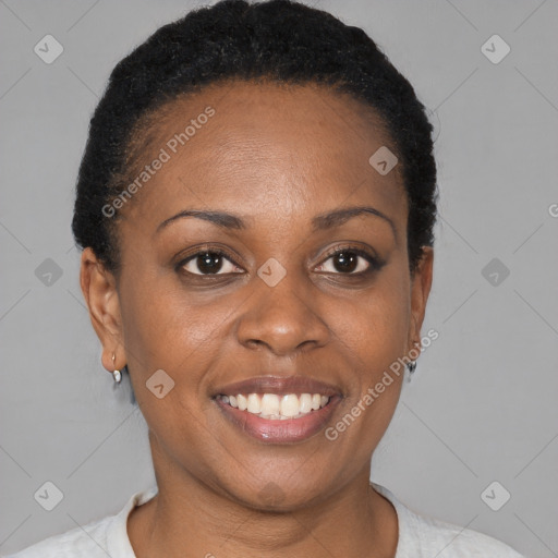 Joyful black young-adult female with short  black hair and brown eyes