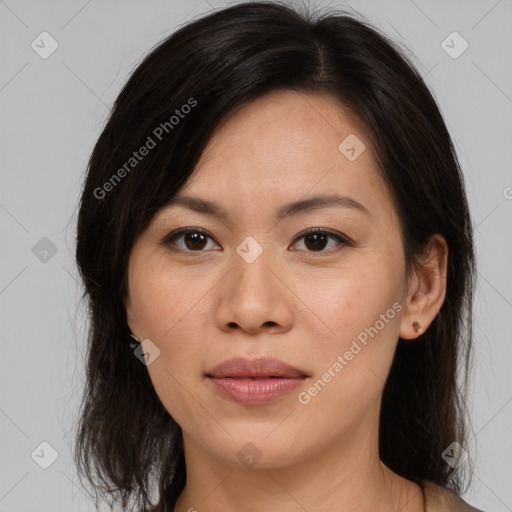 Joyful asian young-adult female with medium  brown hair and brown eyes