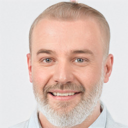 Joyful white adult male with short  brown hair and grey eyes