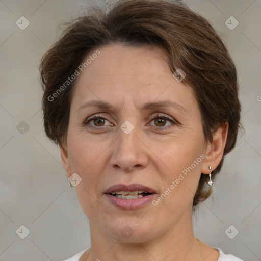 Joyful white adult female with medium  brown hair and brown eyes