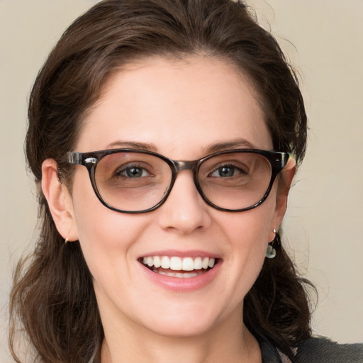 Joyful white young-adult female with medium  brown hair and blue eyes