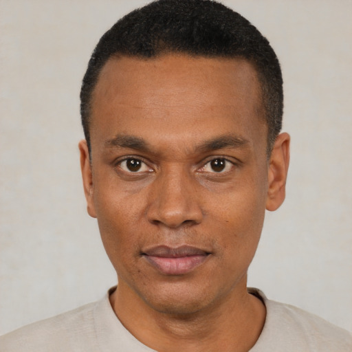 Neutral black young-adult male with short  black hair and brown eyes