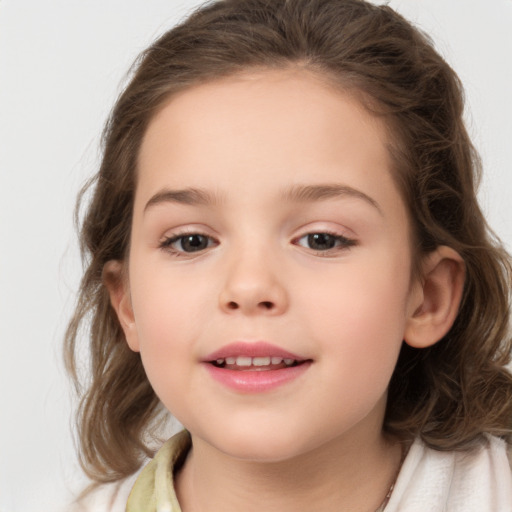 Joyful white child female with medium  brown hair and brown eyes