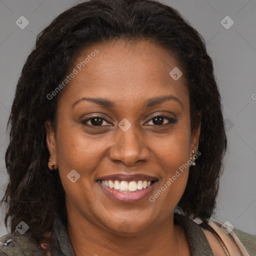 Joyful black adult female with medium  brown hair and brown eyes