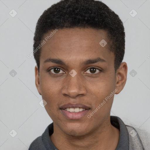 Joyful black young-adult male with short  brown hair and brown eyes