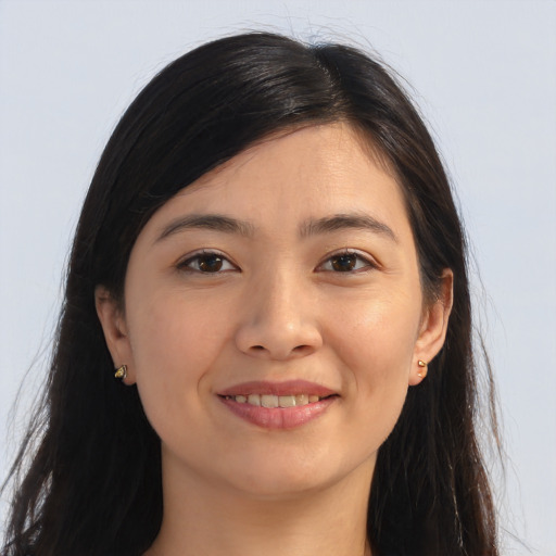 Joyful asian young-adult female with long  brown hair and brown eyes