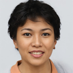 Joyful asian young-adult female with short  brown hair and brown eyes