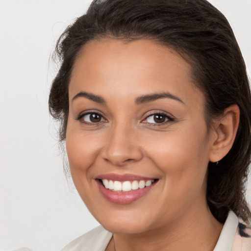 Joyful white young-adult female with medium  brown hair and brown eyes