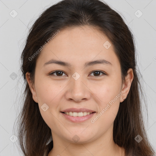 Joyful white young-adult female with long  brown hair and brown eyes