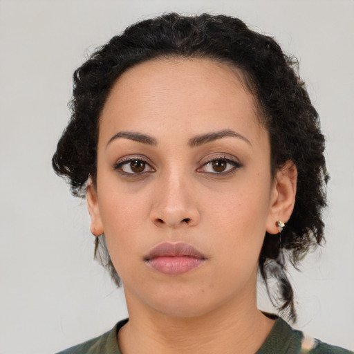 Neutral latino young-adult female with medium  brown hair and brown eyes