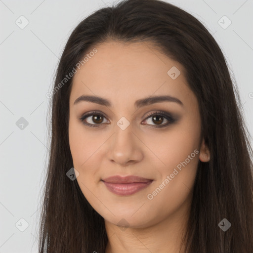 Joyful latino young-adult female with long  brown hair and brown eyes