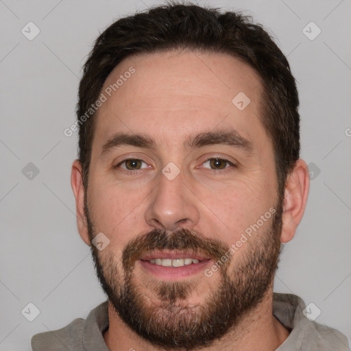 Joyful white adult male with short  brown hair and brown eyes