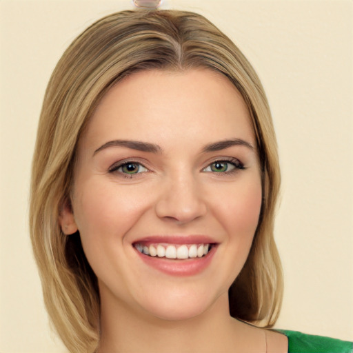 Joyful white young-adult female with medium  brown hair and green eyes