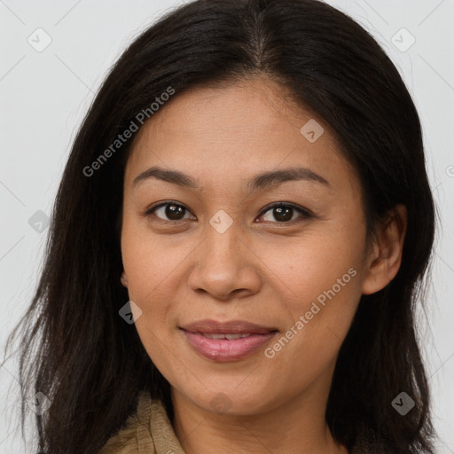 Joyful asian young-adult female with long  brown hair and brown eyes