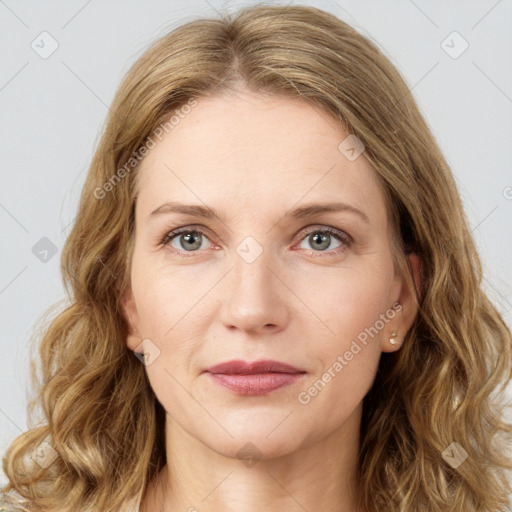 Joyful white young-adult female with long  brown hair and green eyes