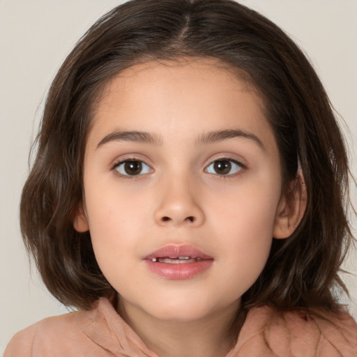 Joyful white child female with medium  brown hair and brown eyes