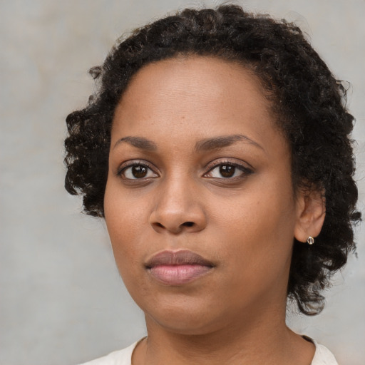 Neutral black young-adult female with short  brown hair and brown eyes