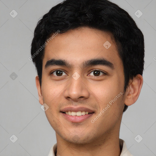 Joyful latino young-adult male with short  black hair and brown eyes