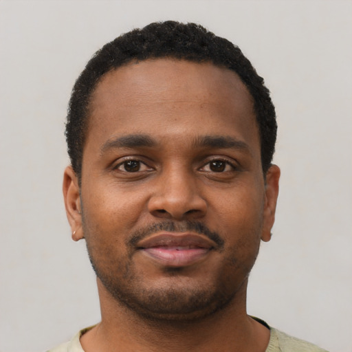 Neutral black young-adult male with short  black hair and brown eyes