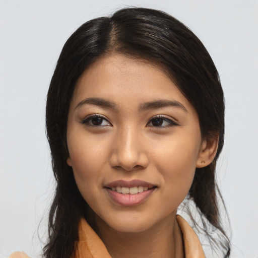 Joyful latino young-adult female with medium  black hair and brown eyes