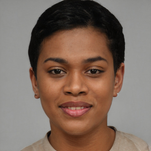 Joyful latino young-adult female with short  black hair and brown eyes