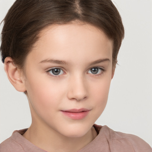 Joyful white child female with short  brown hair and brown eyes