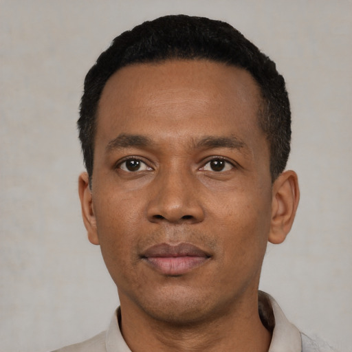 Neutral black young-adult male with short  black hair and brown eyes