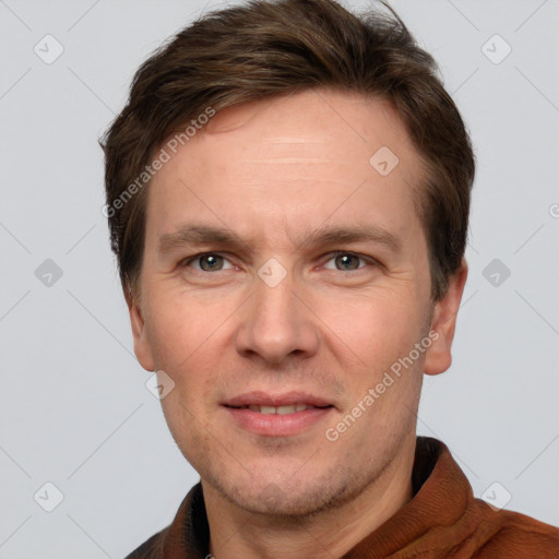 Joyful white adult male with short  brown hair and grey eyes