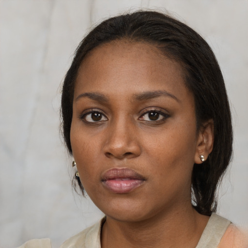 Neutral black young-adult female with medium  black hair and brown eyes