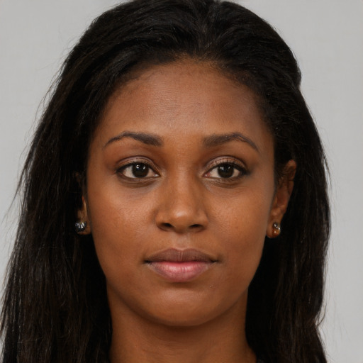 Joyful asian young-adult female with long  brown hair and brown eyes