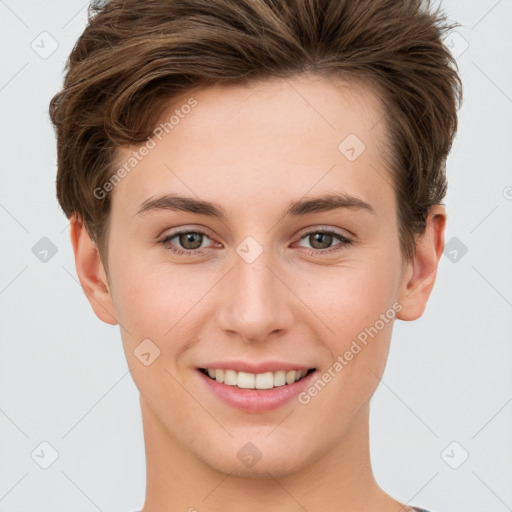 Joyful white young-adult female with short  brown hair and grey eyes