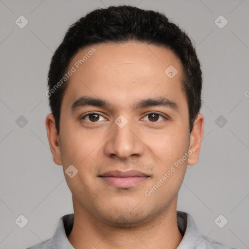 Joyful white young-adult male with short  black hair and brown eyes