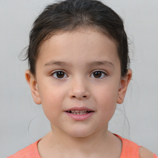 Joyful white child female with short  brown hair and brown eyes