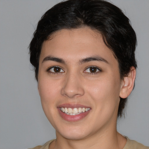 Joyful white young-adult female with medium  brown hair and brown eyes