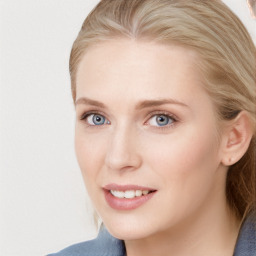 Joyful white young-adult female with long  brown hair and blue eyes