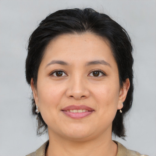 Joyful asian young-adult female with medium  brown hair and brown eyes
