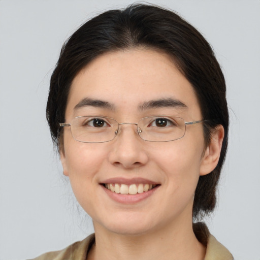 Joyful white young-adult female with medium  brown hair and brown eyes