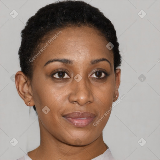 Joyful black young-adult female with short  brown hair and brown eyes