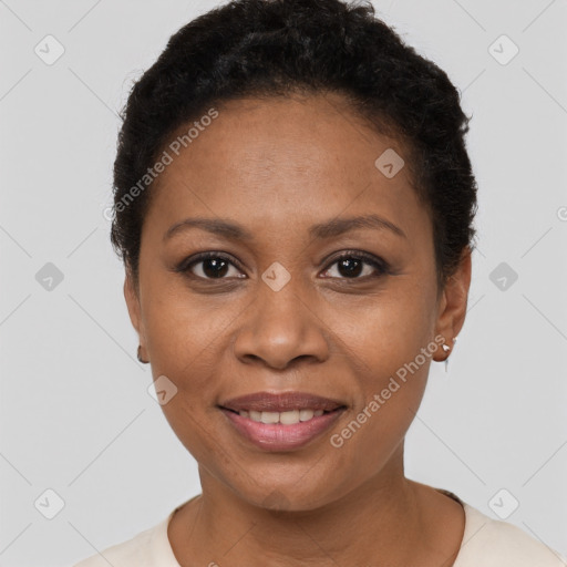 Joyful black young-adult female with short  brown hair and brown eyes