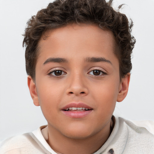 Joyful white child male with short  brown hair and brown eyes