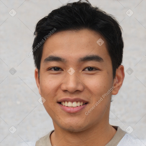 Joyful asian young-adult male with short  black hair and brown eyes