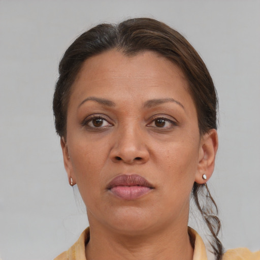Joyful white adult female with short  brown hair and brown eyes