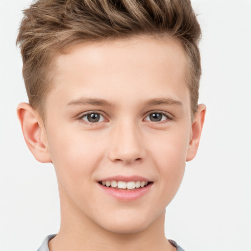 Joyful white child male with short  brown hair and brown eyes