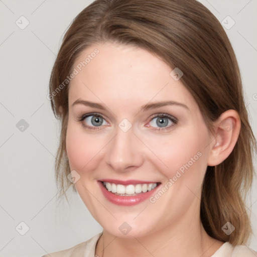 Joyful white young-adult female with medium  brown hair and blue eyes